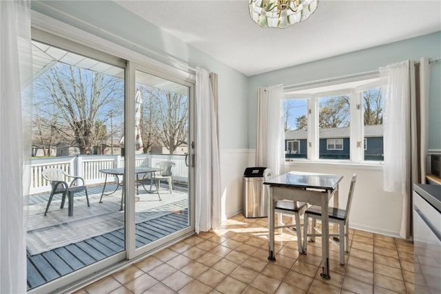 dining area featuring a chandelier and light tile patterned floors