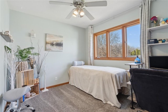 carpeted bedroom featuring baseboards and a ceiling fan
