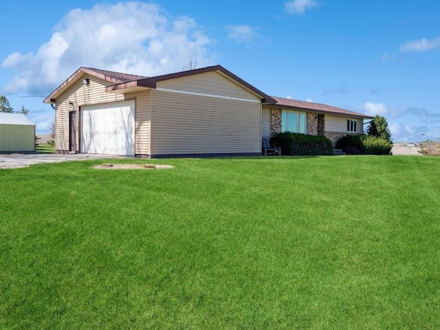 7101 28th Ave, Newhall, IA 52315 - ranch-style home featuring a front yard, a garage, and concrete driveway