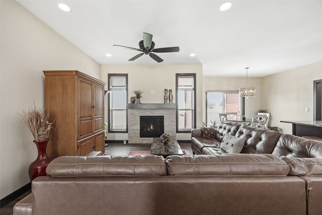 living area featuring a wealth of natural light, wood finished floors, and baseboards
