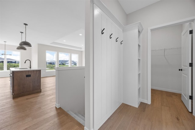 1442 Cardinal Dr, Fairfax, IA 52228 - mudroom featuring light wood-style flooring and a sink