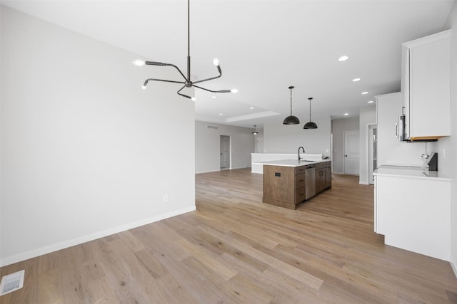 1442 Cardinal Dr, Fairfax, IA 52228 - kitchen with open floor plan, stainless steel appliances, a chandelier, light wood-type flooring, and recessed lighting