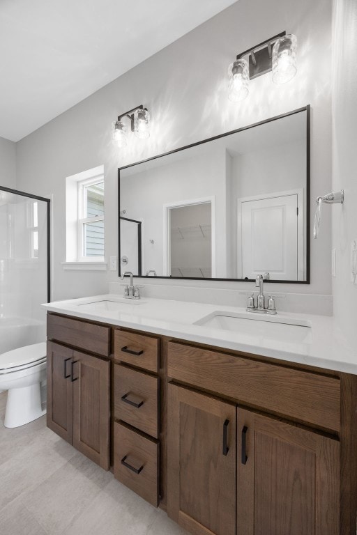 1442 Cardinal Dr, Fairfax, IA 52228 - bathroom featuring double vanity and tile patterned flooring