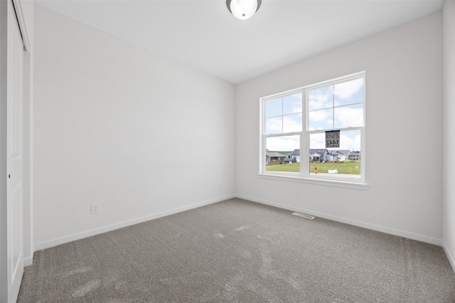 1442 Cardinal Dr, Fairfax, IA 52228 - carpeted empty room with baseboards