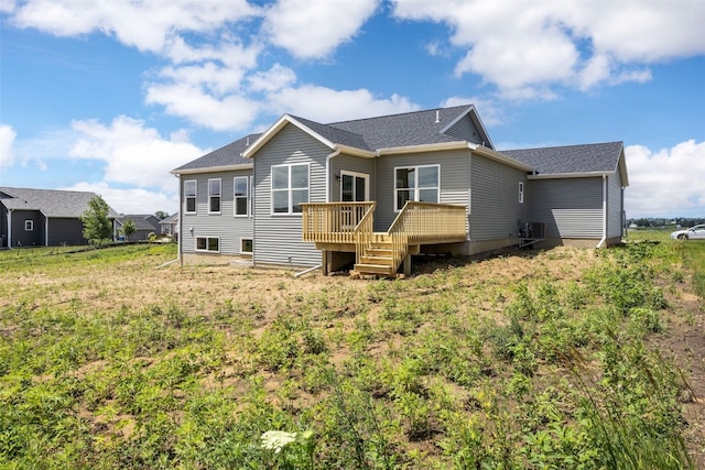 1442 Cardinal Dr, Fairfax, IA 52228 - rear view of property with a wooden deck and roof with shingles
