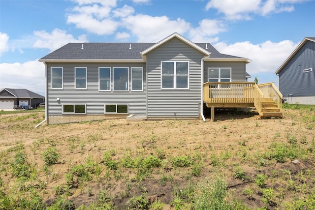 1442 Cardinal Dr, Fairfax, IA 52228 - rear view of property with a deck and a shingled roof