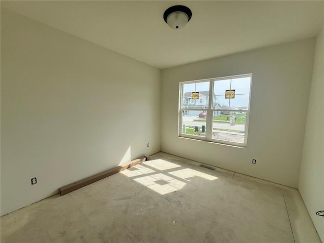 spare room featuring visible vents