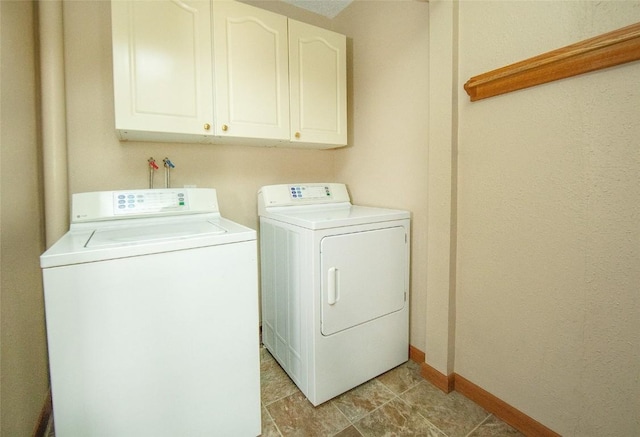 110 SE 12th St, Oelwein, IA 50662 - laundry room with washing machine and dryer, baseboards, and cabinet space