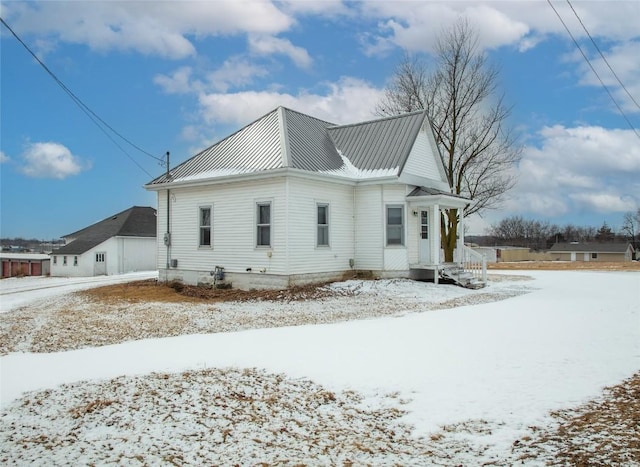 110 SE 12th St, Oelwein, IA 50662 - snow covered property featuring metal roof