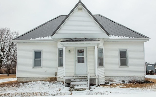 110 SE 12th St, Oelwein, IA 50662 - view of front of house featuring entry steps and metal roof