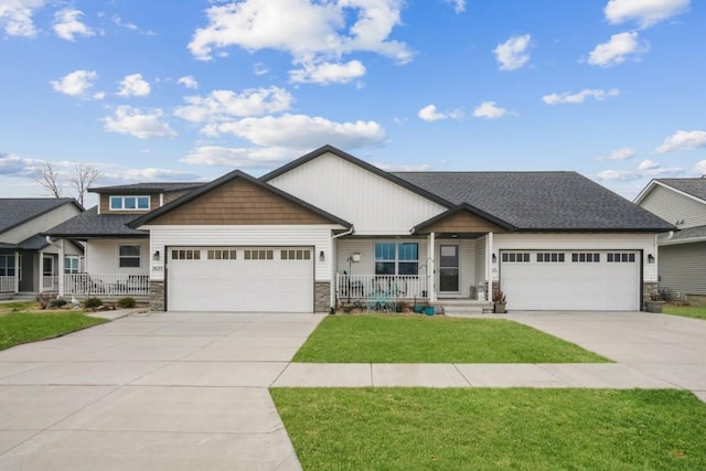 1609 Petrus Dr NE, Cedar Rapids, IA 52402 - craftsman inspired home with stone siding, an attached garage, driveway, and a porch