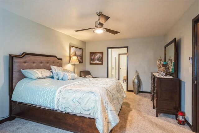 bedroom featuring light carpet, baseboards, and ceiling fan