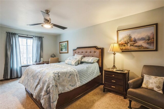 bedroom with carpet and a ceiling fan
