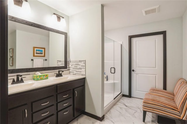 bathroom featuring a stall shower, marble finish floor, visible vents, and a sink