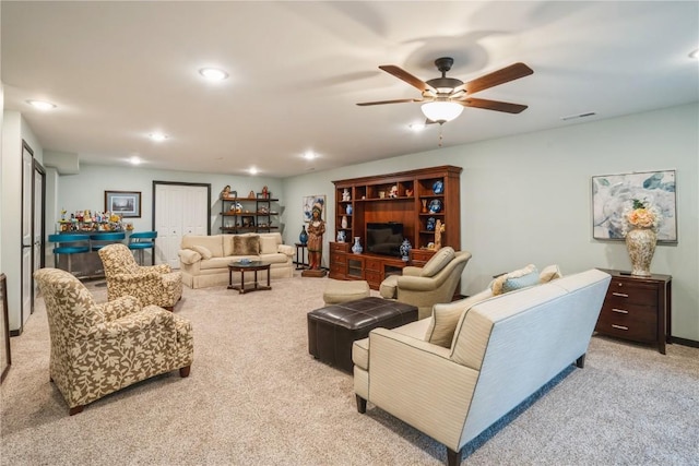 1609 Petrus Dr NE, Cedar Rapids, IA 52402 - living area with light colored carpet, ceiling fan, and recessed lighting