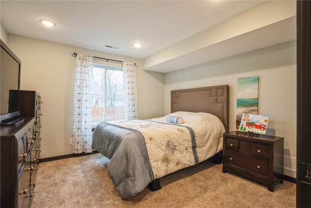 bedroom with light colored carpet, visible vents, baseboards, and recessed lighting