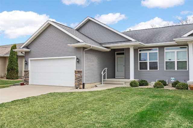 345 Shannon Dr, Robins, IA 52328 - ranch-style house featuring a shingled roof, a garage, a front yard, and driveway