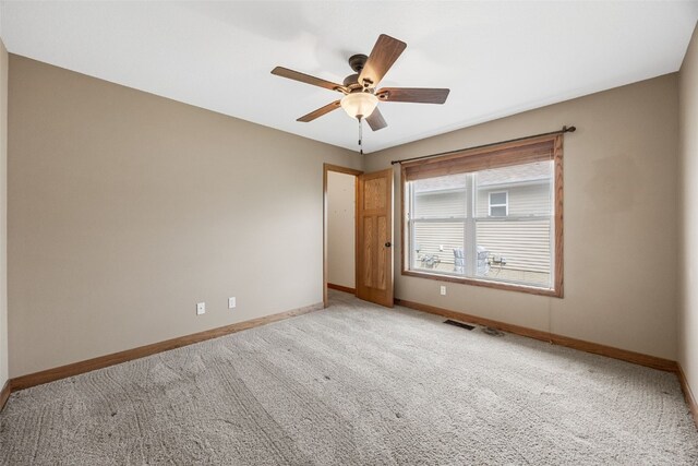 345 Shannon Dr, Robins, IA 52328 - spare room with visible vents, baseboards, ceiling fan, and light colored carpet