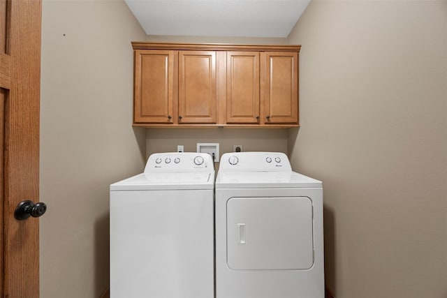 345 Shannon Dr, Robins, IA 52328 - clothes washing area with cabinet space and separate washer and dryer