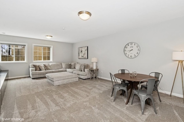 living room featuring baseboards and carpet floors