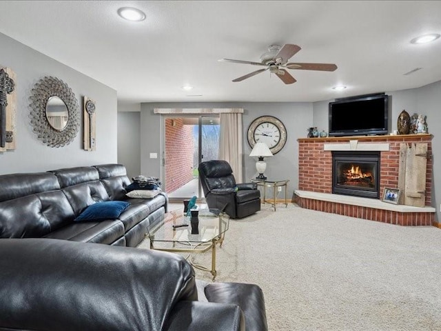3752 Lacina Dr SW, Iowa City, IA 52240 - living room featuring carpet floors, a ceiling fan, recessed lighting, and a fireplace