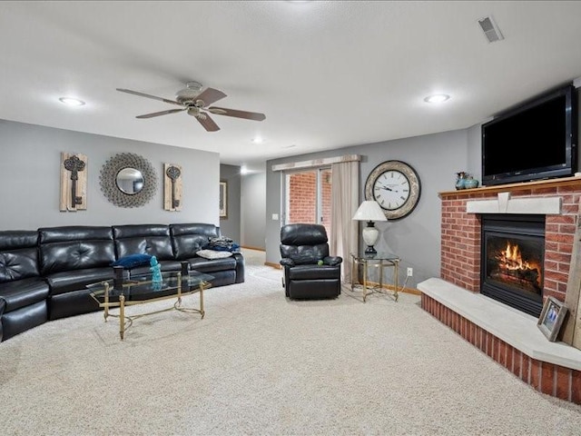 3752 Lacina Dr SW, Iowa City, IA 52240 - living area featuring recessed lighting, a fireplace, carpet flooring, a ceiling fan, and visible vents