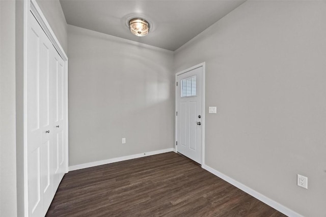 2068 Whispering Meadow Dr, Iowa City, IA 52240 - foyer entrance with baseboards and dark wood finished floors