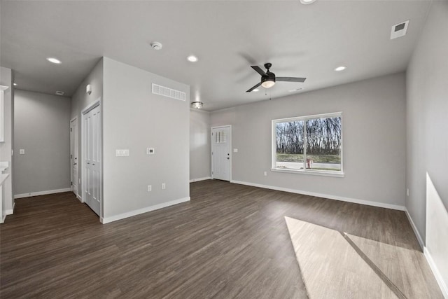 2068 Whispering Meadow Dr, Iowa City, IA 52240 - unfurnished living room featuring dark wood-style flooring, baseboards, a ceiling fan, and visible vents