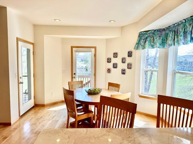 dining area featuring baseboards, recessed lighting, and light wood-style floors