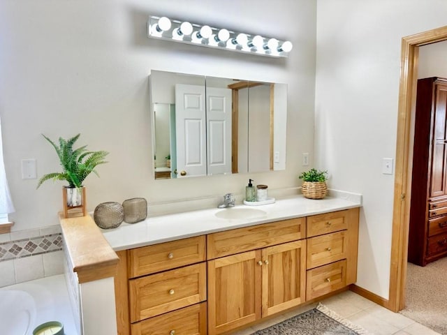 full bathroom with tile patterned flooring, vanity, and a bathing tub
