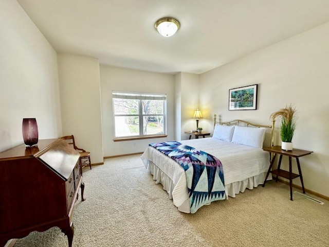 carpeted bedroom featuring baseboards