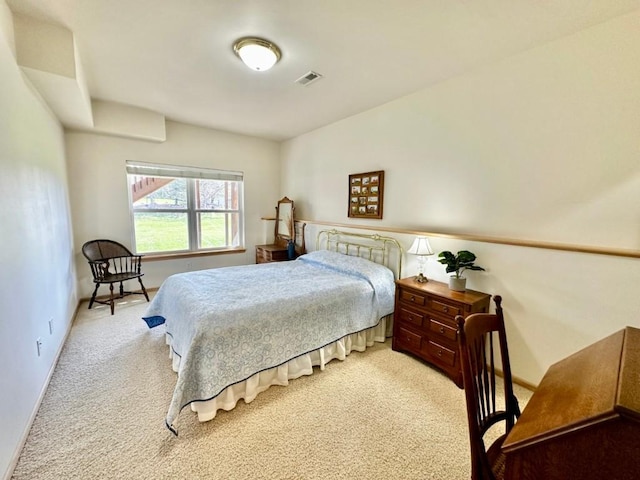 bedroom featuring visible vents, baseboards, and carpet floors