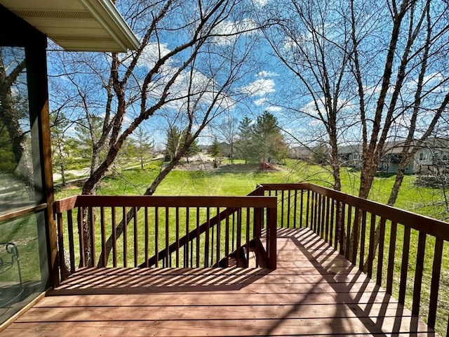 wooden terrace with a yard