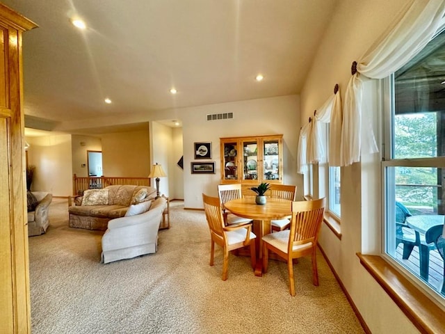 dining space with visible vents, baseboards, recessed lighting, and light carpet