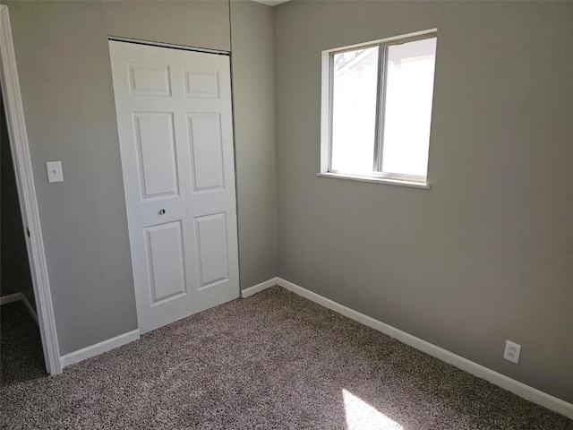 1025 Pawnee Dr NW, Cedar Rapids, IA 52405 - unfurnished bedroom with carpet and baseboards