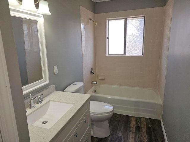 full bathroom with shower / bath combination, vanity, toilet, and wood finished floors