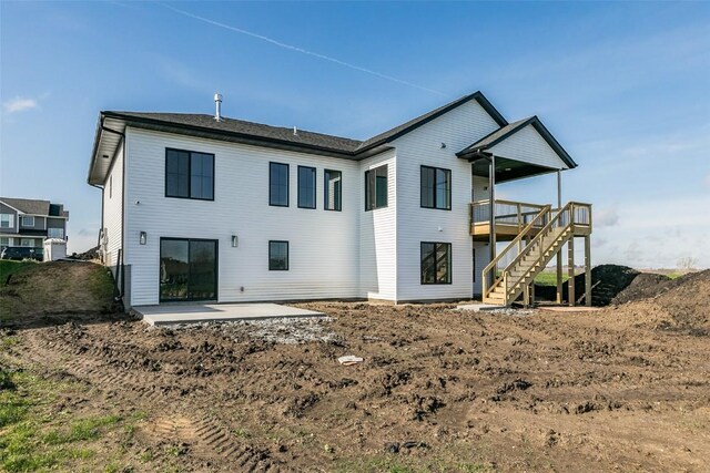 4018 Peridot Dr, Marion, IA 52302 - back of house featuring stairs, a wooden deck, and a patio area