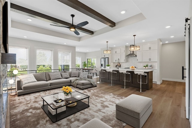 4018 Peridot Dr, Marion, IA 52302 - living area featuring recessed lighting, light wood-type flooring, ceiling fan, and beam ceiling
