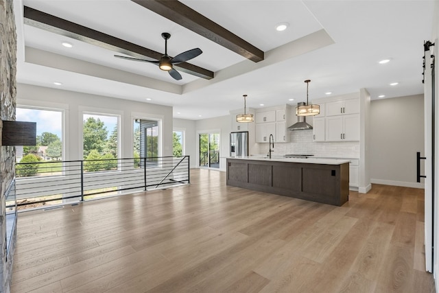 4018 Peridot Dr, Marion, IA 52302 - kitchen with stainless steel refrigerator with ice dispenser, white cabinets, recessed lighting, light countertops, and decorative backsplash