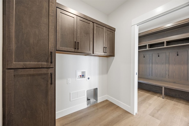 4018 Peridot Dr, Marion, IA 52302 - washroom featuring cabinet space, light wood finished floors, hookup for an electric dryer, and hookup for a washing machine