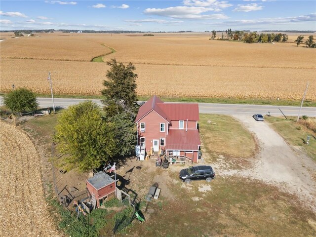 birds eye view of property with a rural view