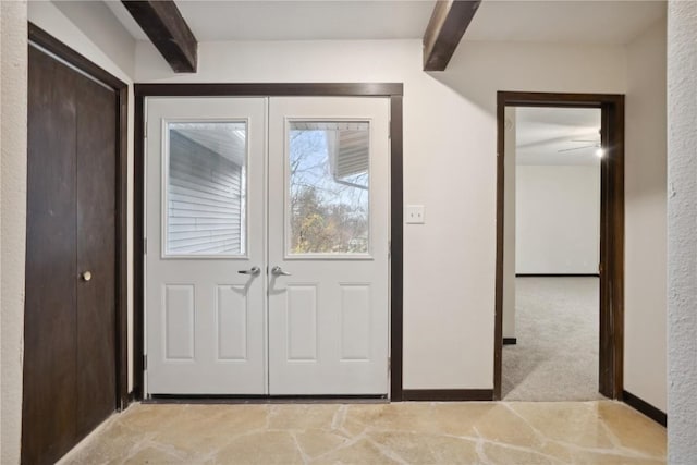 3111 Carroll Dr SE, Cedar Rapids, IA 52403 - entryway featuring beam ceiling and light carpet