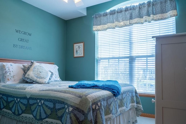 bedroom with multiple windows