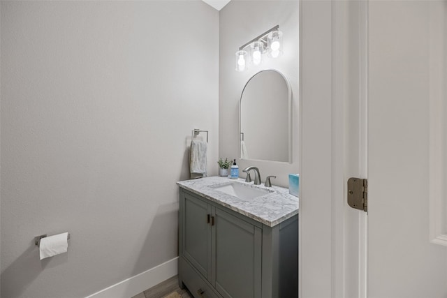 bathroom featuring vanity and baseboards