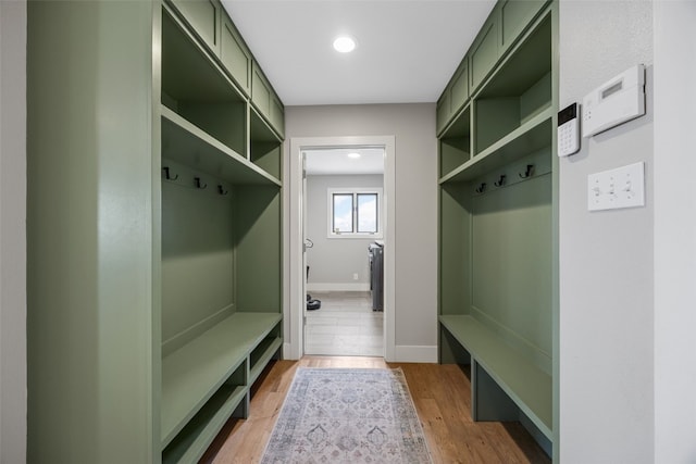 mudroom with baseboards, recessed lighting, and wood finished floors
