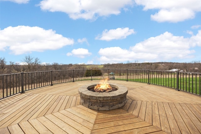 wooden deck with an outdoor fire pit