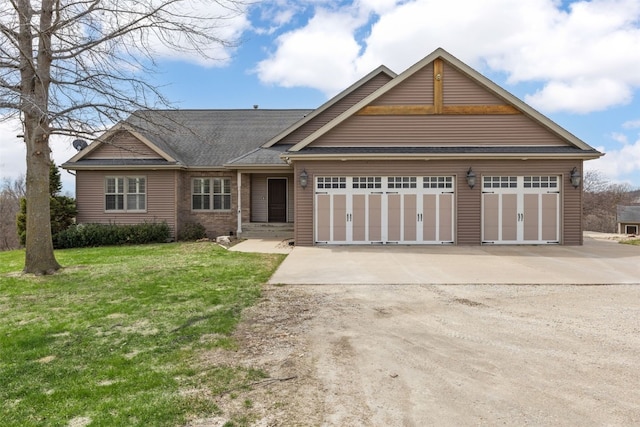 single story home with a front lawn, an attached garage, driveway, and roof with shingles