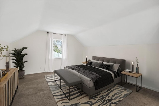 carpeted bedroom featuring vaulted ceiling and baseboards