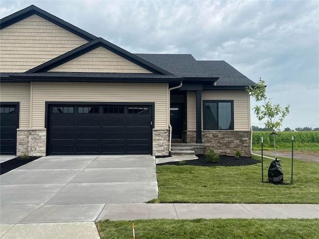 1232 Berkshire Ln, North Liberty, IA 52317 - craftsman inspired home featuring concrete driveway, stone siding, a front yard, and a garage