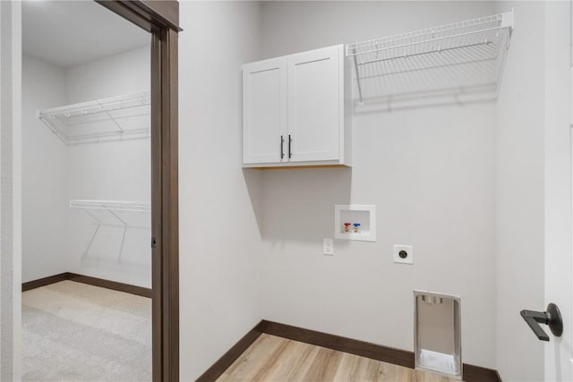 1232 Berkshire Ln, North Liberty, IA 52317 - laundry room with cabinet space, hookup for an electric dryer, hookup for a washing machine, baseboards, and light wood finished floors